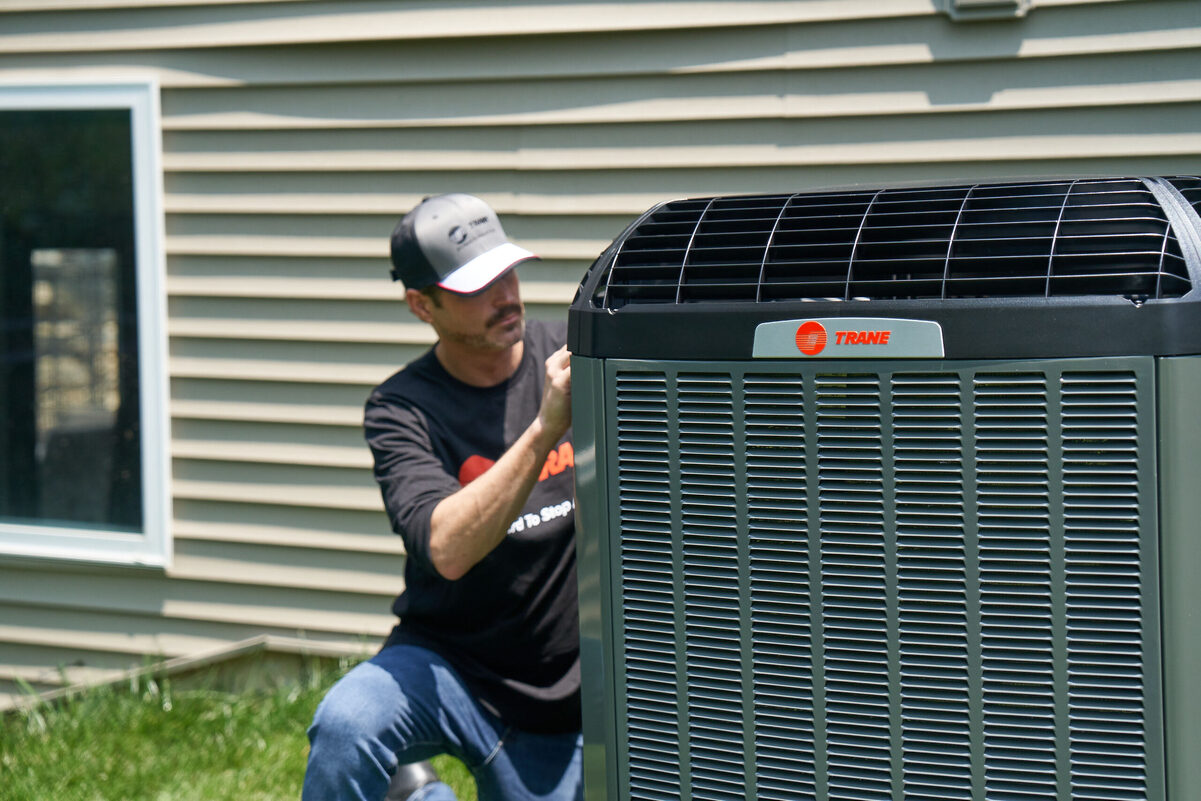 air conditioning unit with HVAC tech